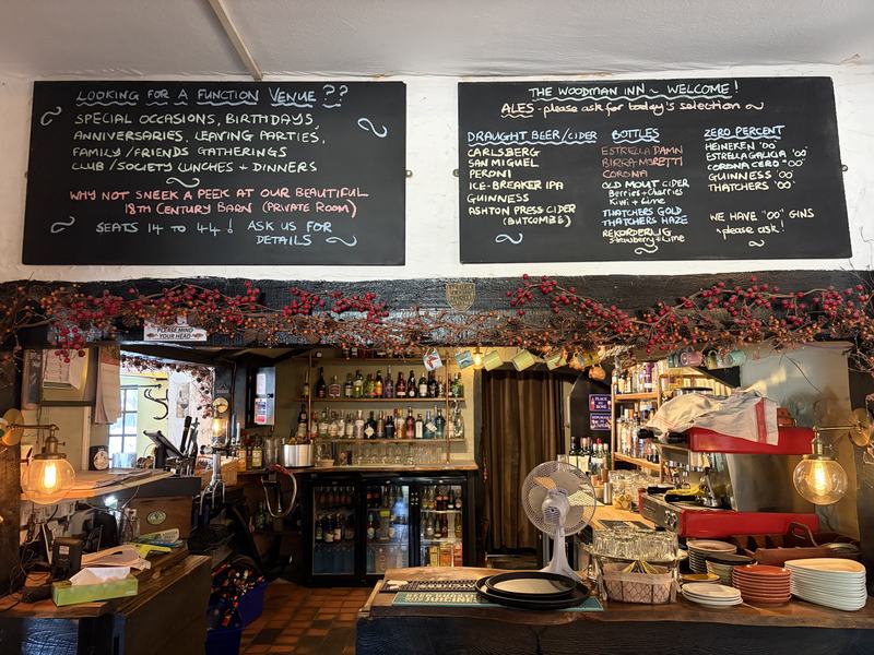 Chalkboards above the bar listing drinks and events