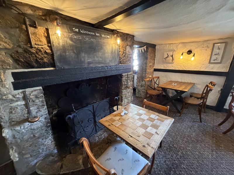 The inglenook fireplace and beamed ceiling in the old bar