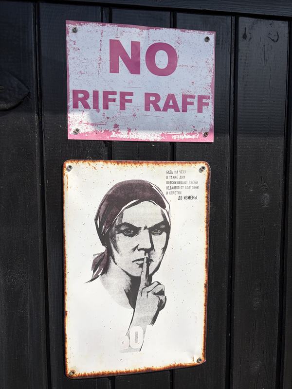 Enamel signs on the black front door